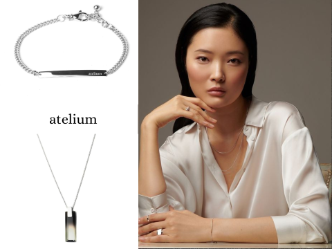 woman with arms folded wearing jewelry